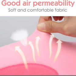 a hand holding a pink blanket