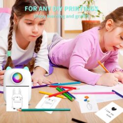 two girls lying on the floor coloring