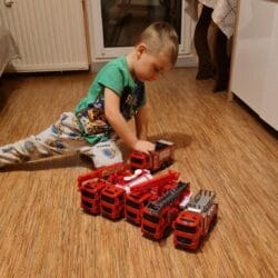 a boy playing with toys