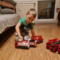 a boy playing with toys